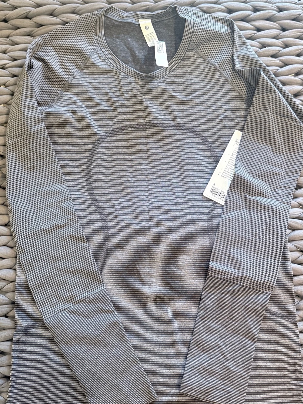 Lululemon Swiftly Tech. Long sleeve. Hip length. NWT. Size 8. Black stripe